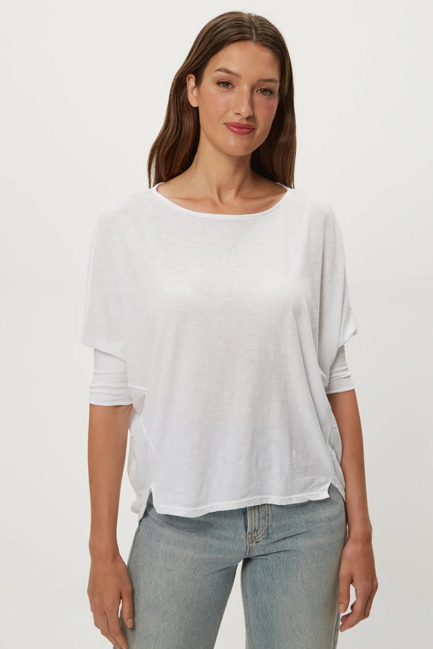 White dolman tee with crew neck, loose short sleeves, draped fit