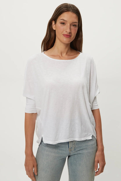 White dolman tee with crew neck, loose short sleeves, draped fit