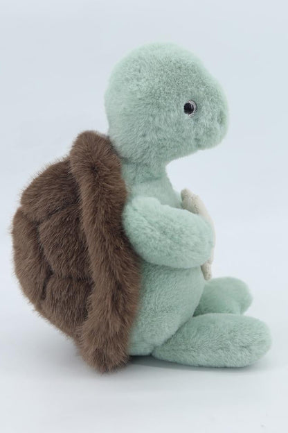 Green plush sea turtle with brown flipper, seated side view