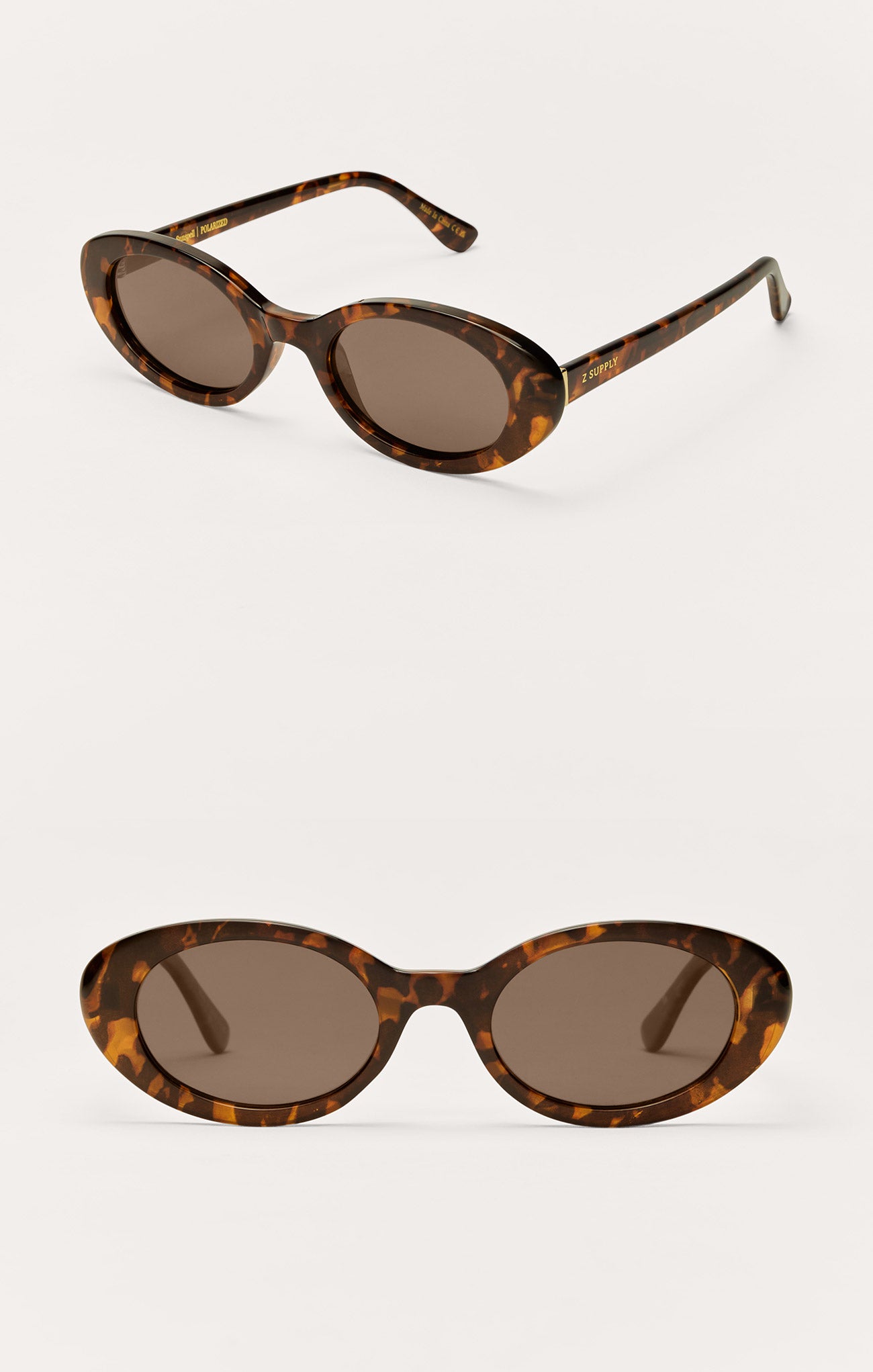 Tortoiseshell oval sunglasses with dark gradient lenses
