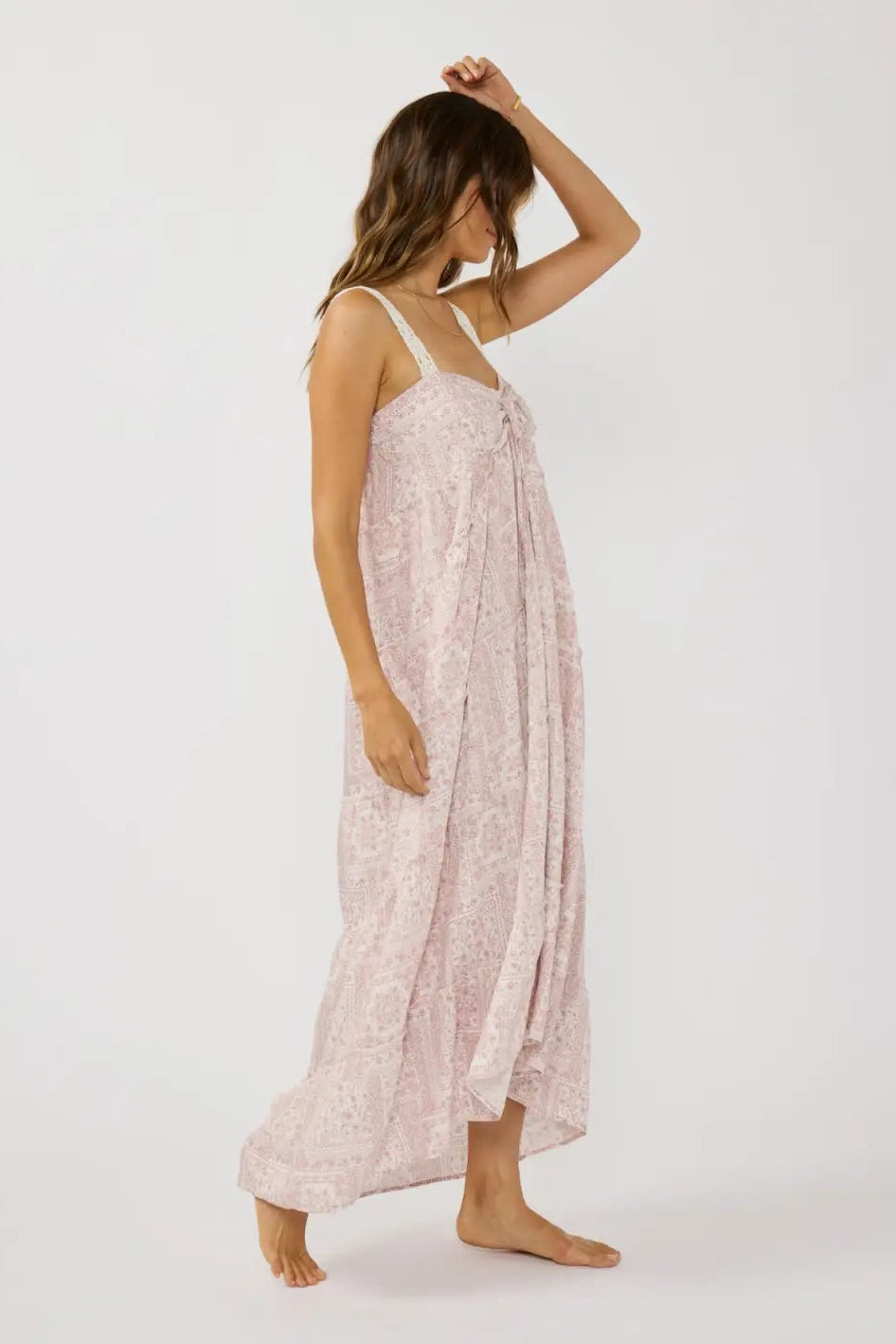 Lace maxi dress with spaghetti straps, side slit, tiered ruffle hem, light rose