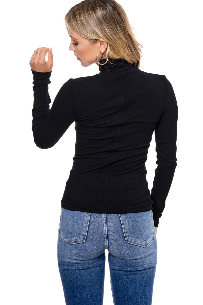 RIBBED LONG SLEEVE TURTLE NECK TOP IN BLACK BACK VIEW