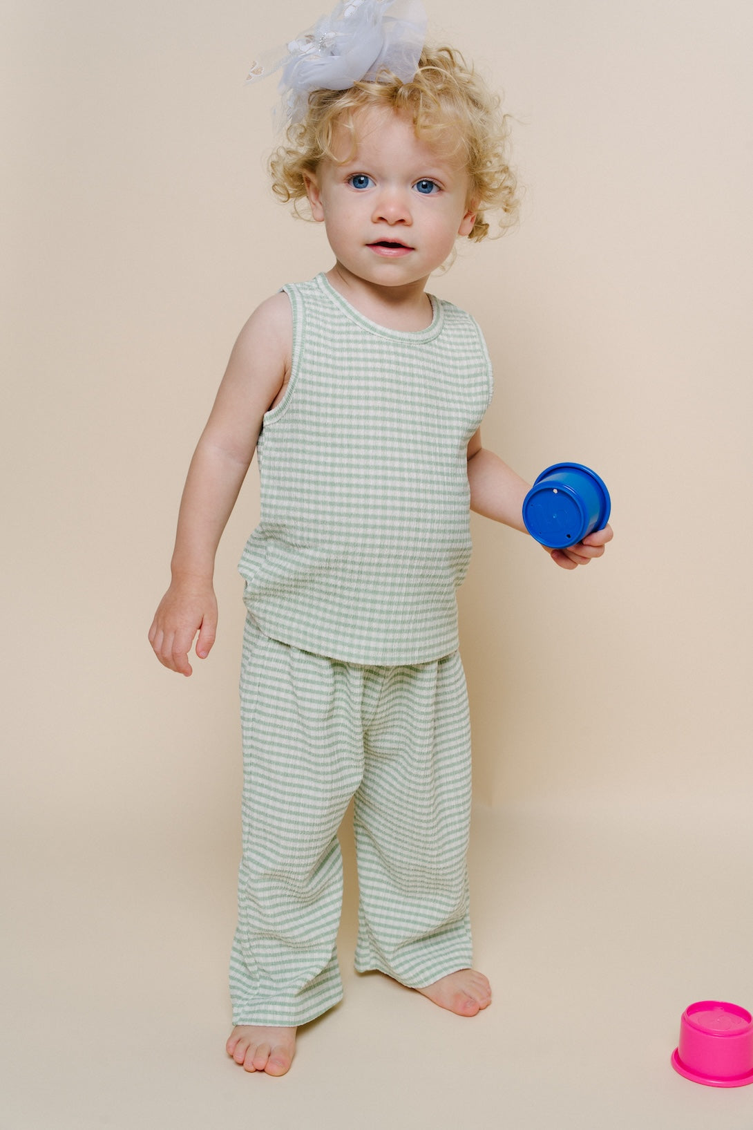 Mint striped tank and wide-leg pants set on baby, sleeveless with bare feet