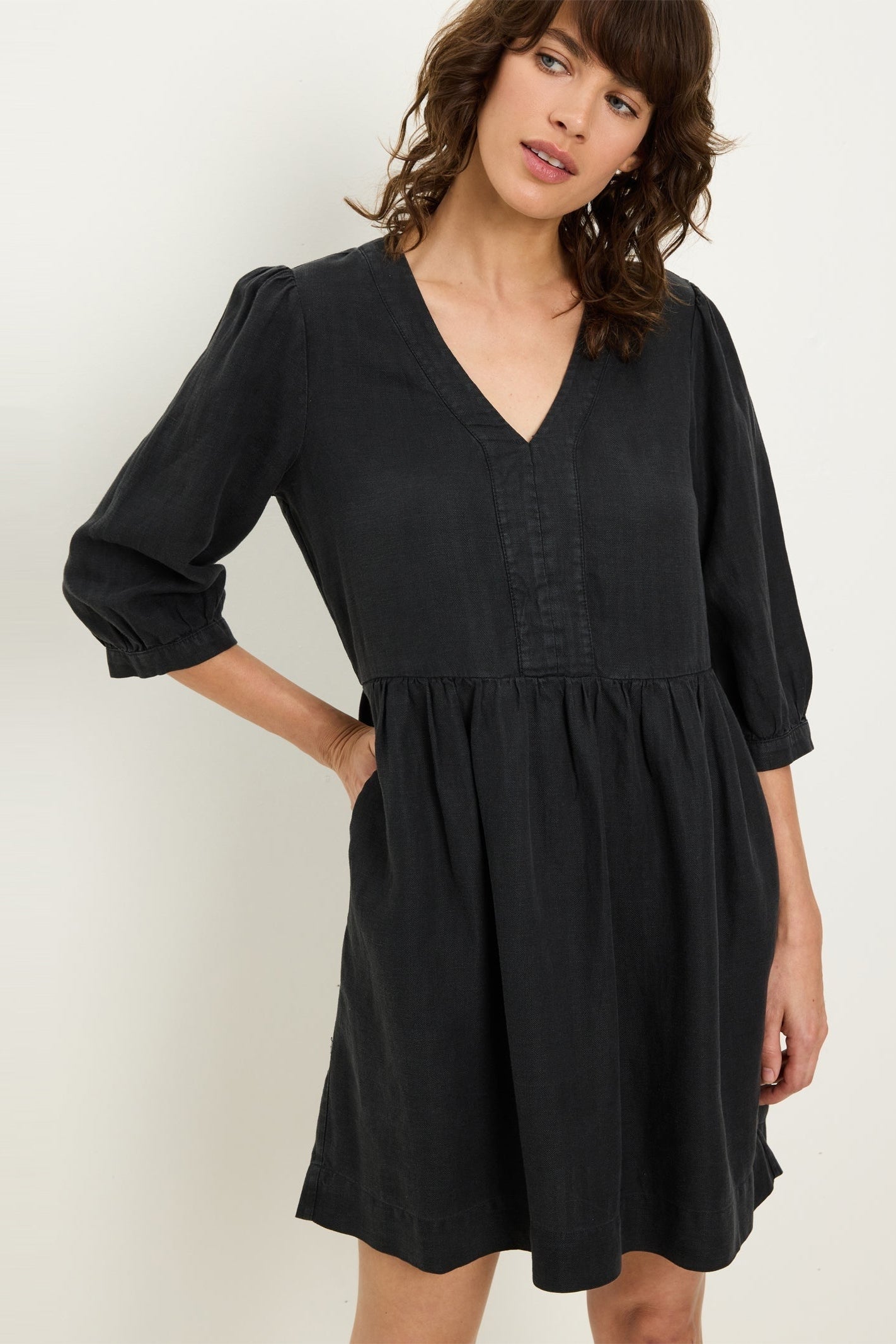 Black V-neck 3/4 sleeve mini dress with gathered waist and puff sleeves