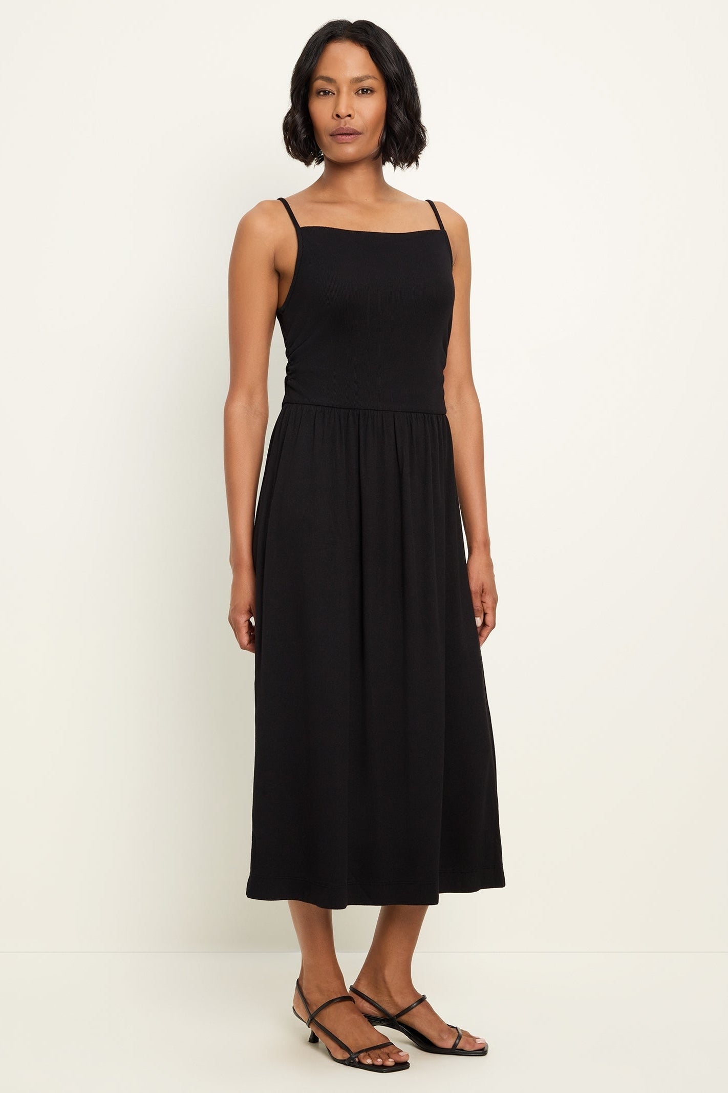 Black square-neck midi dress with spaghetti straps and gathered full skirt