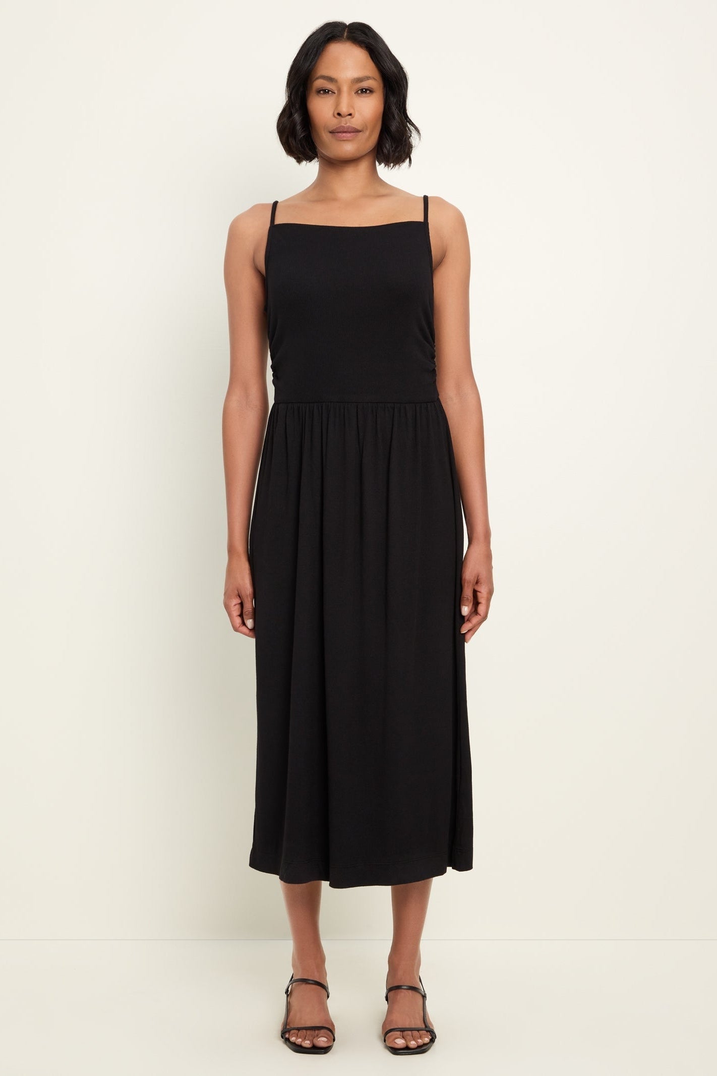 Black square-neck midi dress with spaghetti straps and gathered waist