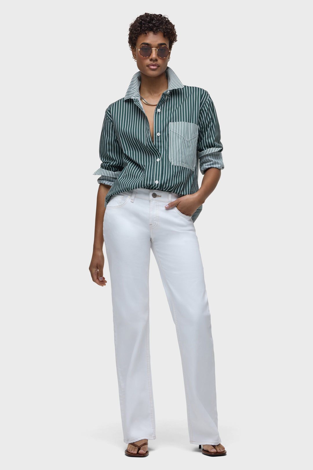 White low-rise loose straight pants with button-front and wide straight legs