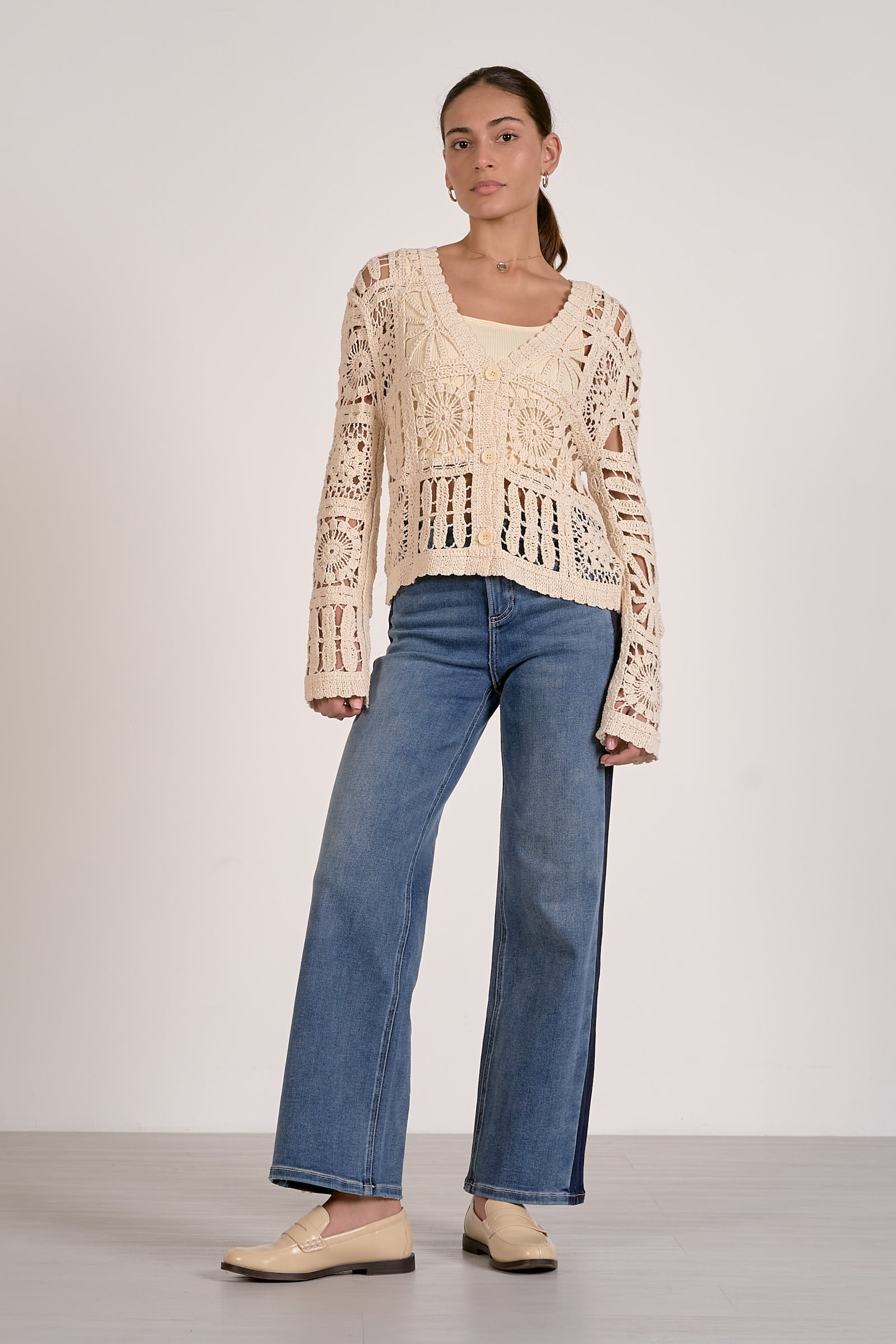 Natural open-knit cardigan sweater with wide scoop neck and long sleeves, crochet openwork