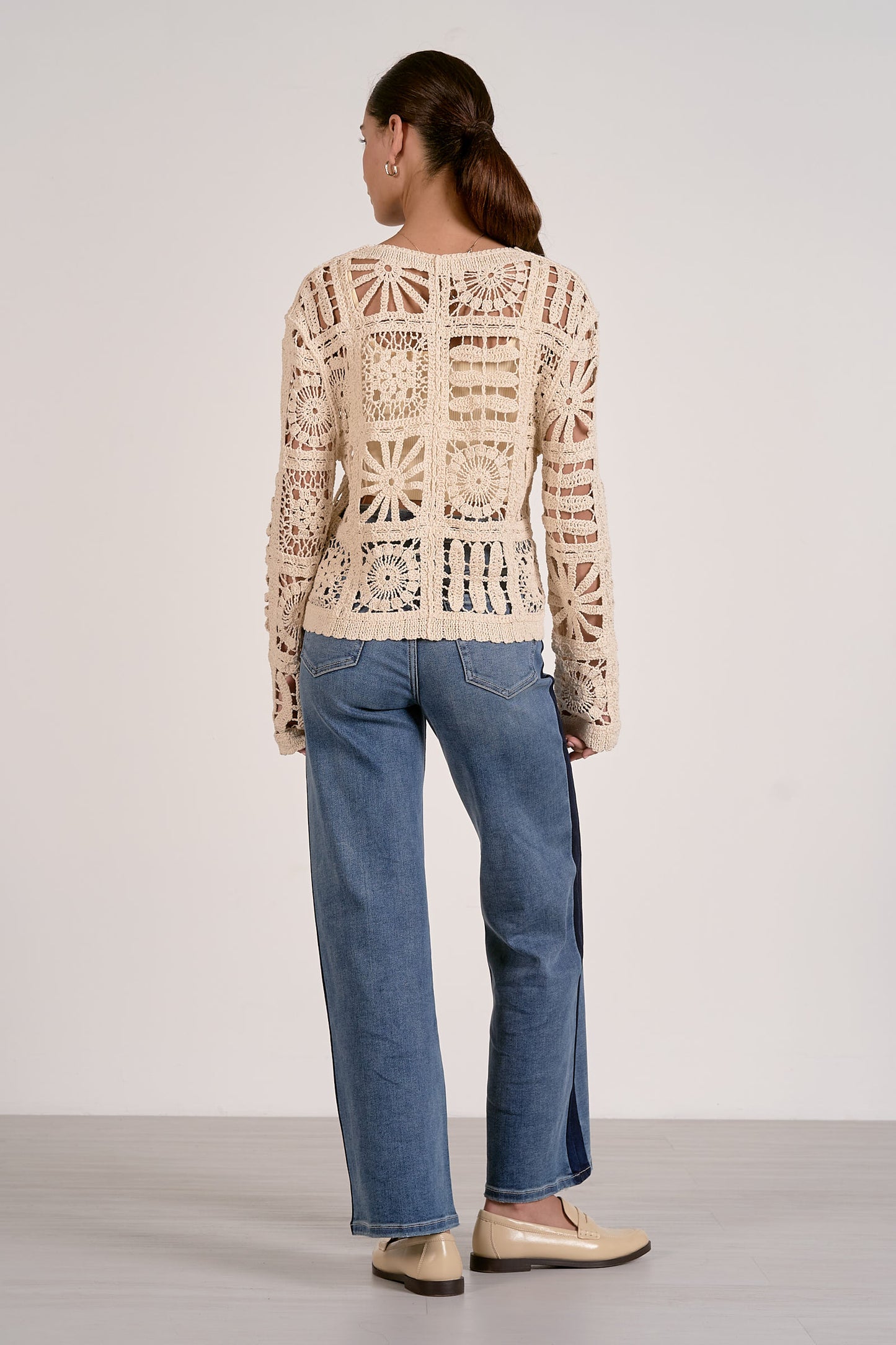 Natural open-knit cardigan sweater back view with long sleeves, crochet openwork