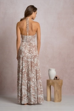 Cut out maxi dress back view, open back straps and tiered floor-length skirt, leaf print