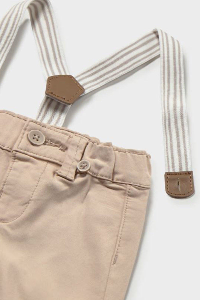 Pants with suspenders in detail front view
