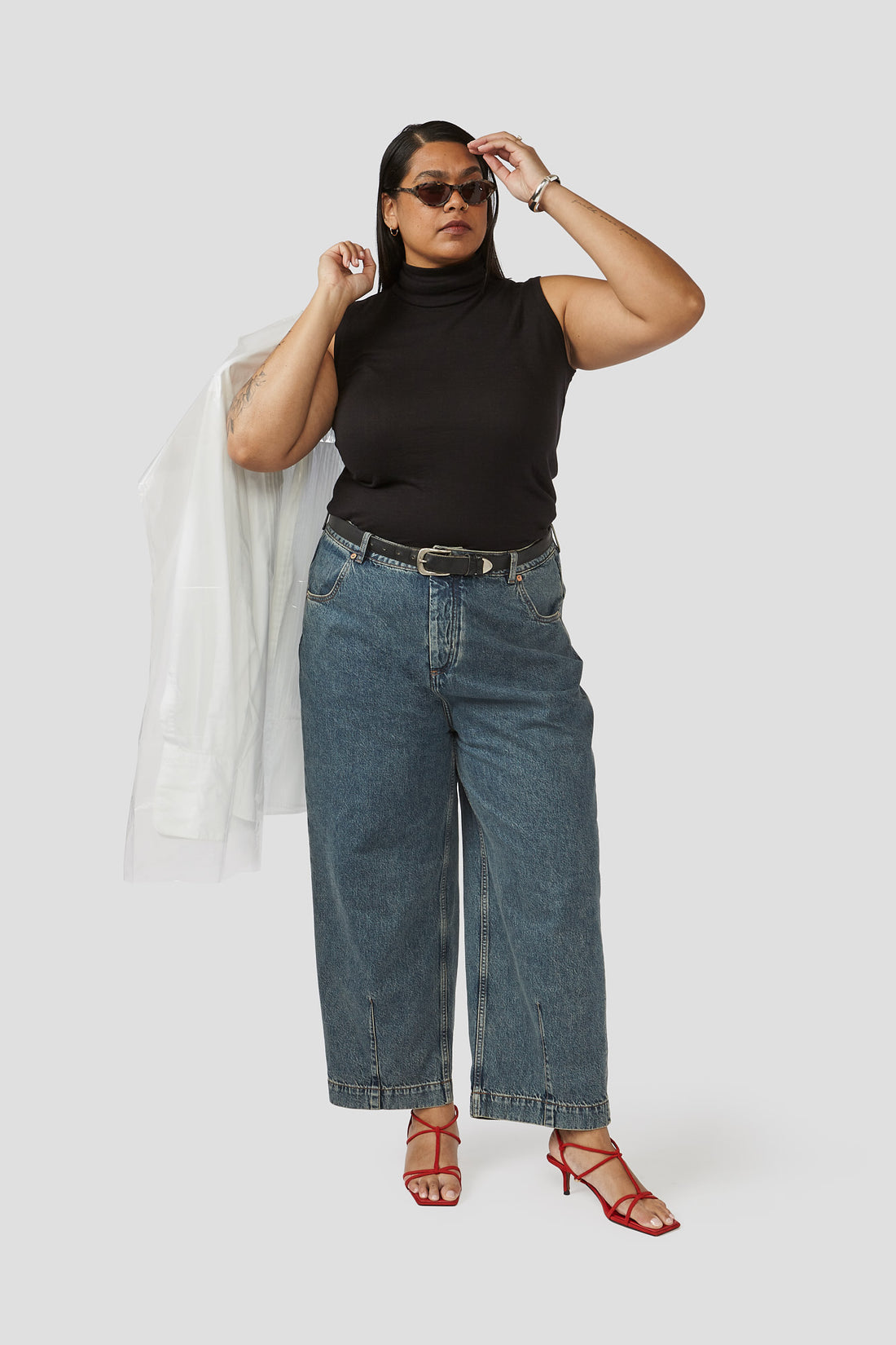 Denim trousers in dark wash with high rise, belt loops, and wide cropped straight leg