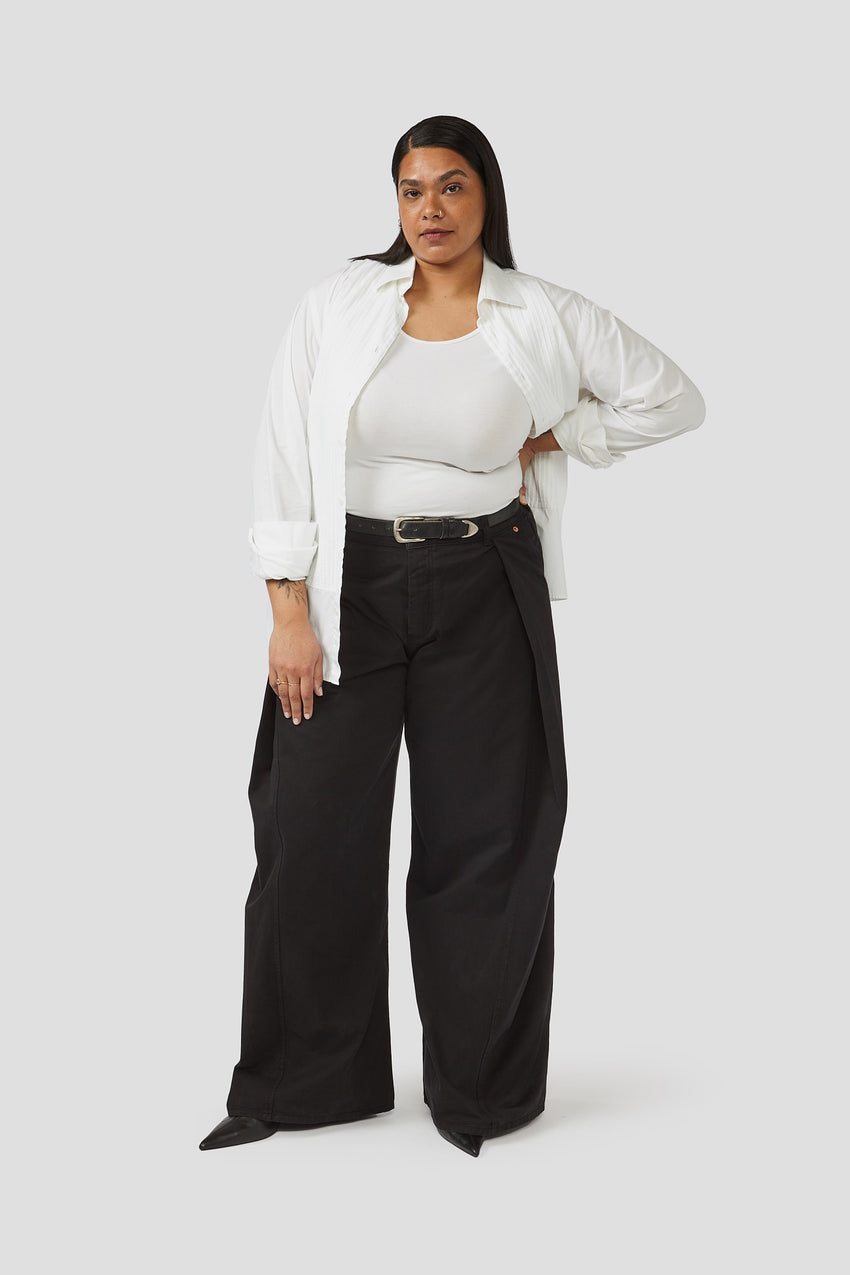 Black wide-leg trousers with built-in belt, side pockets, button waistband