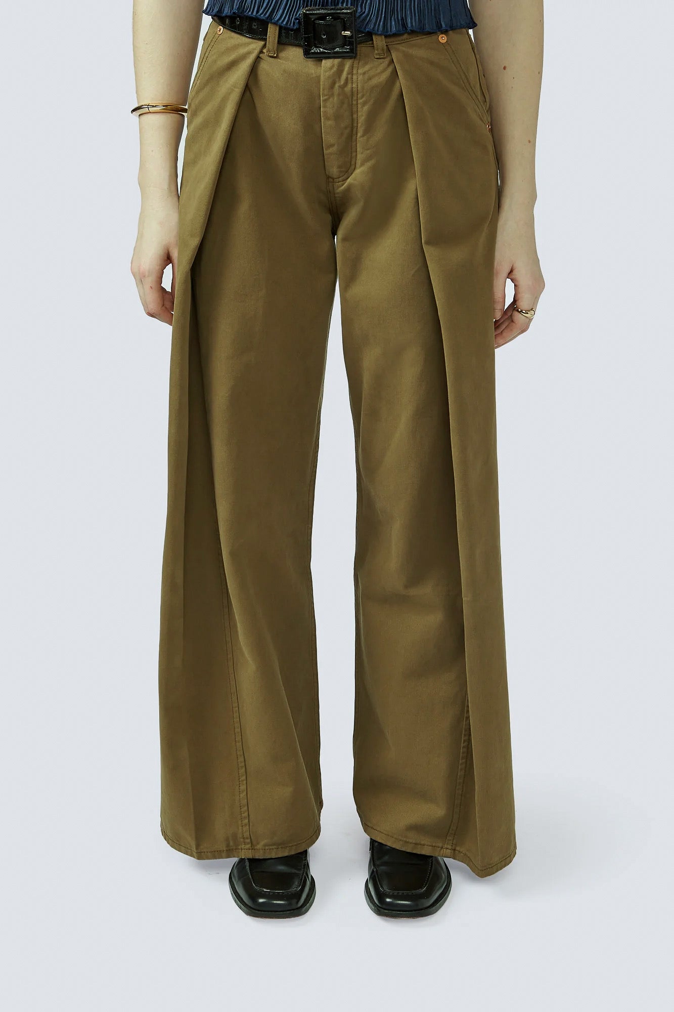Tan wide-leg trousers with belt loops and pleated front, full length