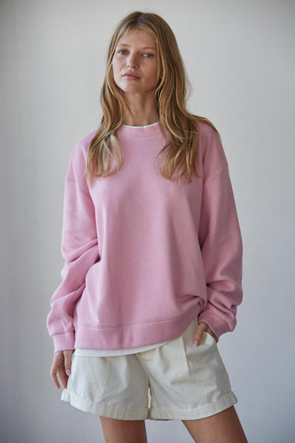 Candy pink crewneck pullover with layered hem, soft fleece sweatshirt