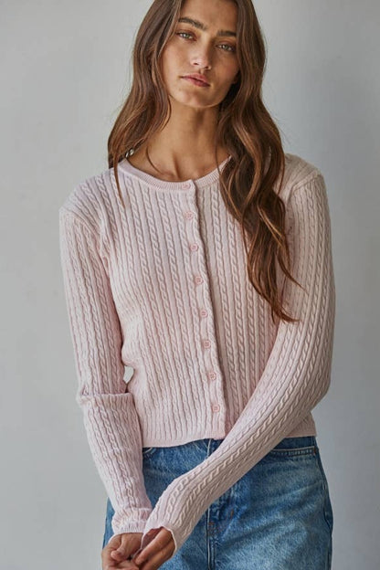 Ballet pink cable knit cardigan top, long sleeves and round neckline with button placket