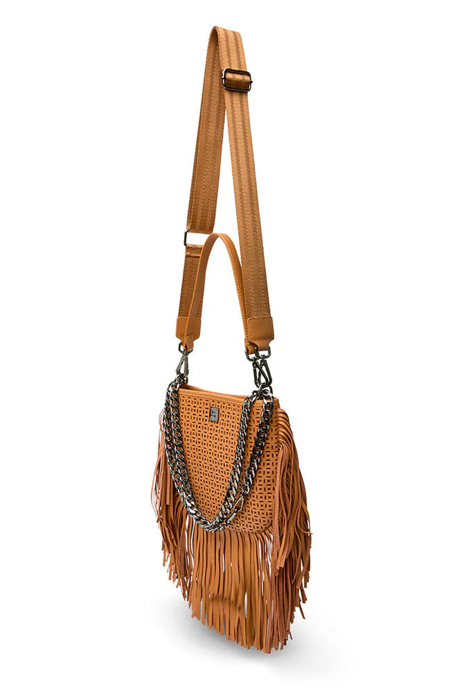 Free spirit fringe saddle bag in terracotta  perferated leather side view with all straps attached