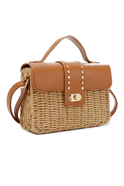Brown top straw handle satchel with twist-lock front and metal stud detail