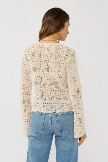 Natural crochet top back view with allover openwork knit and long sleeves