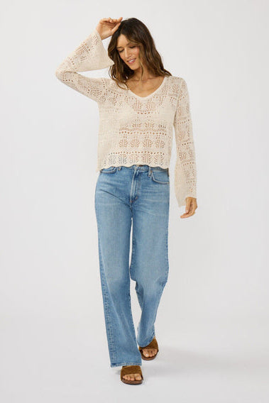 Natural V-neck crochet top with long sleeves, featuring an allover openwork pattern