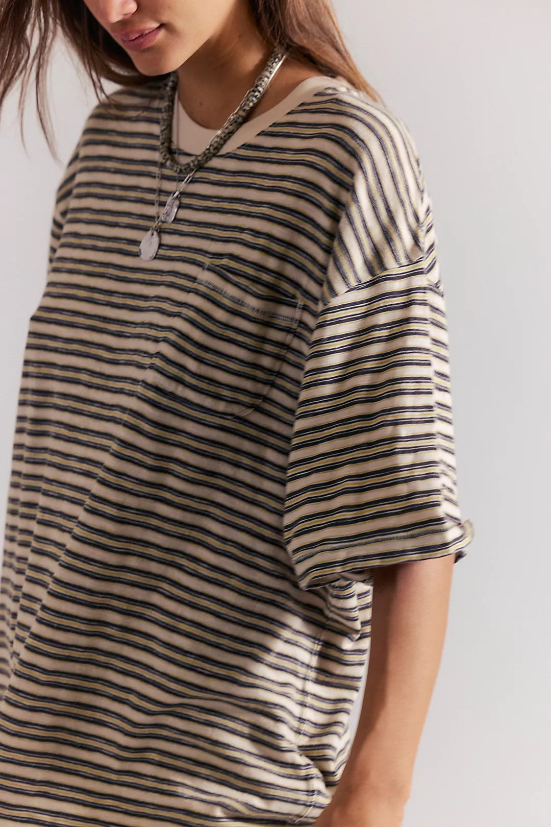 Striped pocket tee close-up with scoop neck and buttons