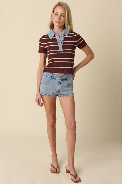 Woman shown wearing Brown and light taupe striped knit polo crop top with denim collar and buttons and denim shorts with brown heeled sandals 