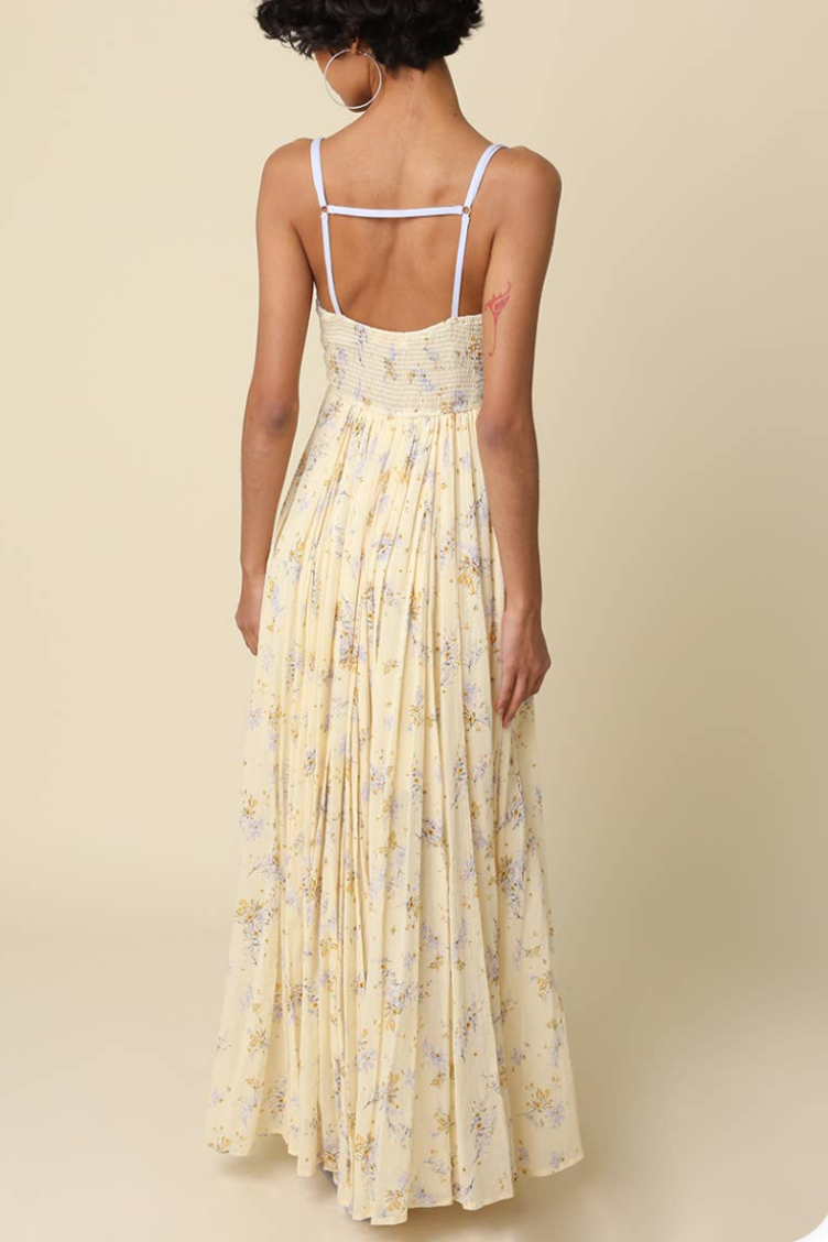 Back view: floral maxi dress with spaghetti straps and tiered smocked back panel
