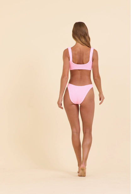 High-waist bikini bottoms in pink, open back with ruched krinkle texture