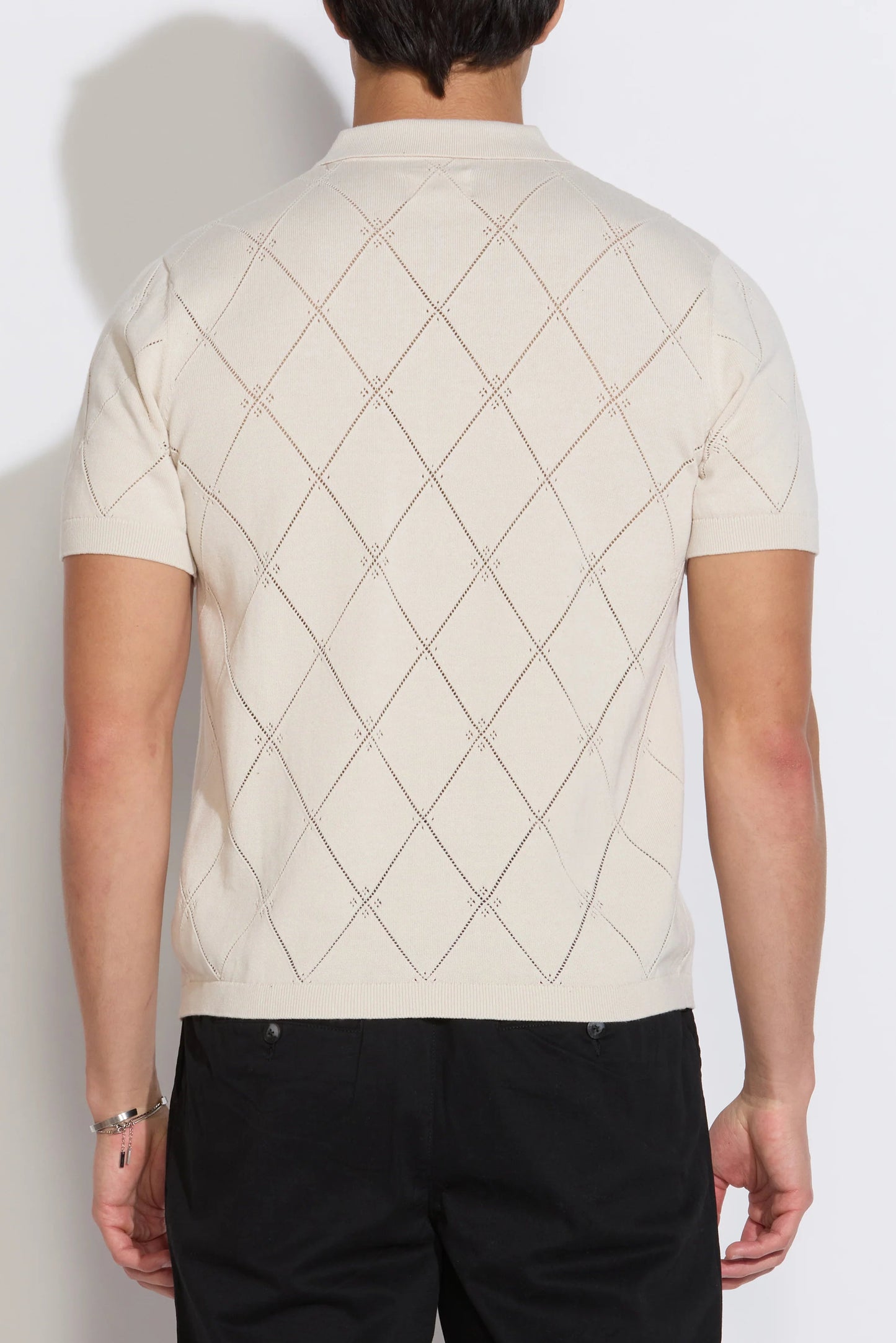 Stone argyle short-sleeve sweater polo, back view with diamond knit pattern