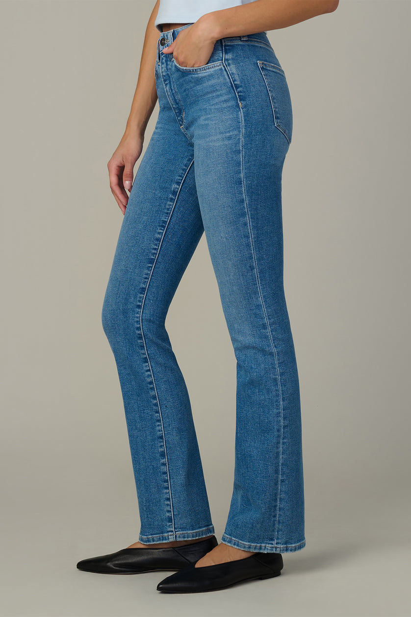 Light blue bootcut jeans, side view, stitched seams and hip pockets