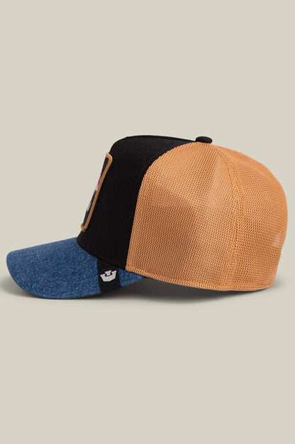 Trucker cap side view, dog patch, black crown, tan mesh back, denim brim