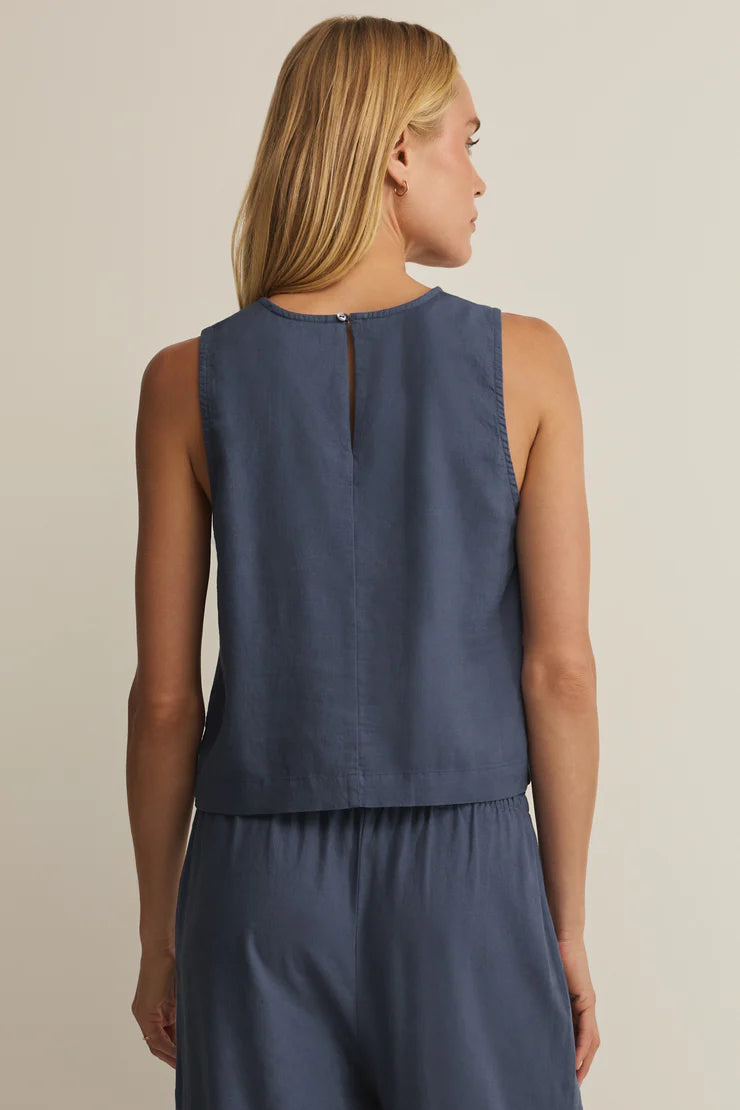 Back view navy linen sleeveless top with keyhole slit at neckline