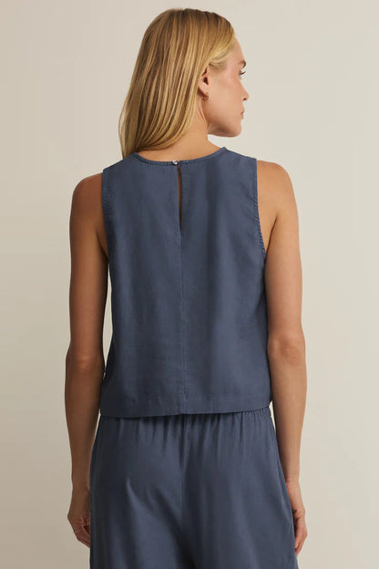 Back view navy linen sleeveless top with keyhole slit at neckline
