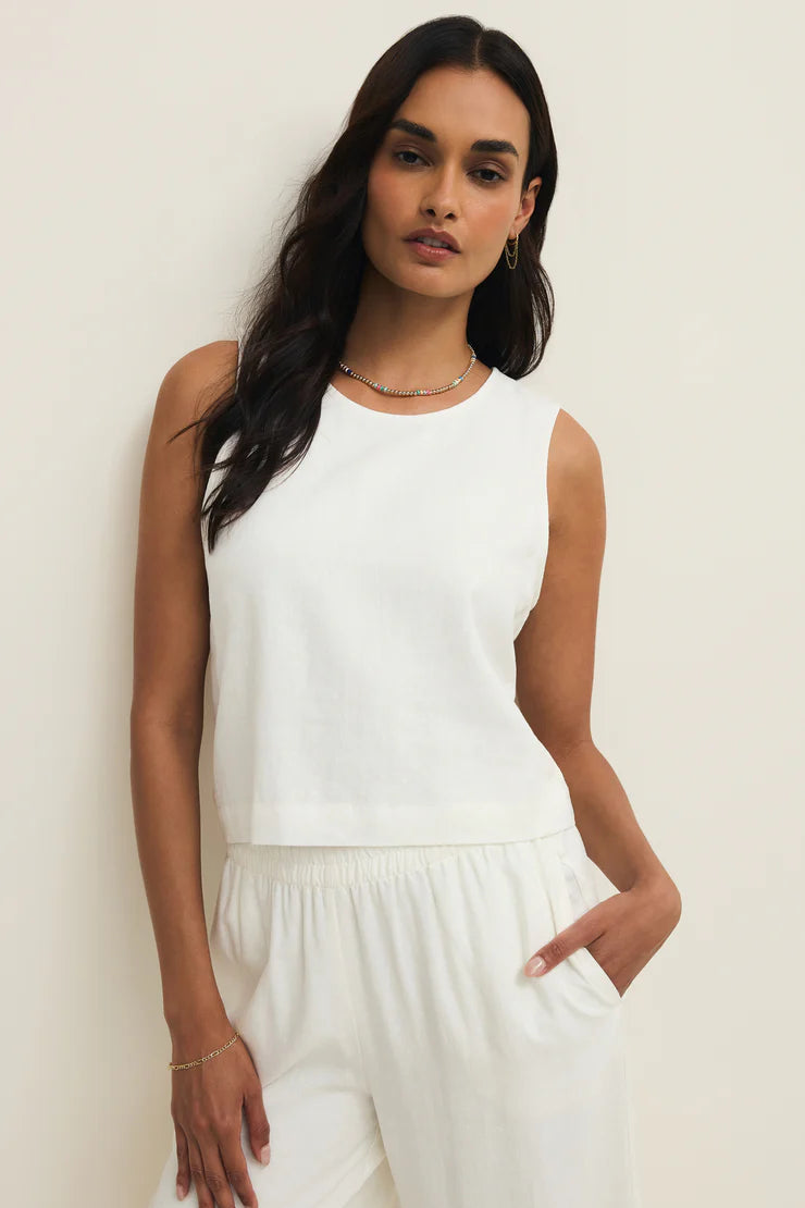 White linen sleeveless top with crew neck and gathered elastic hem