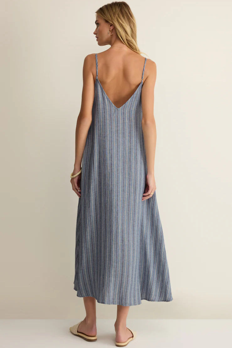 Back view: indigo striped midi dress, low V open back