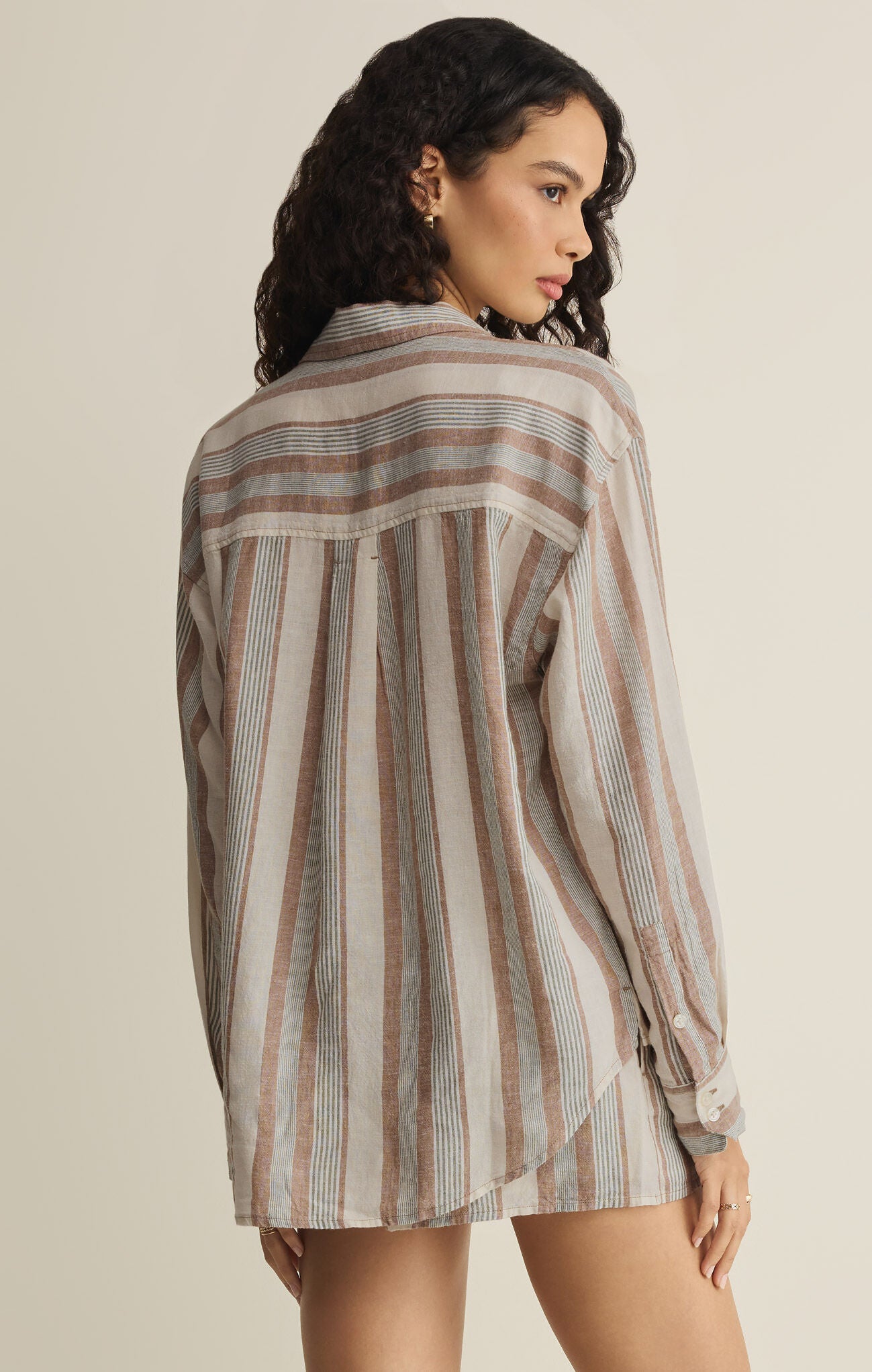 Striped button-up shirt, back view with vertical stripes and long sleeves in light beige