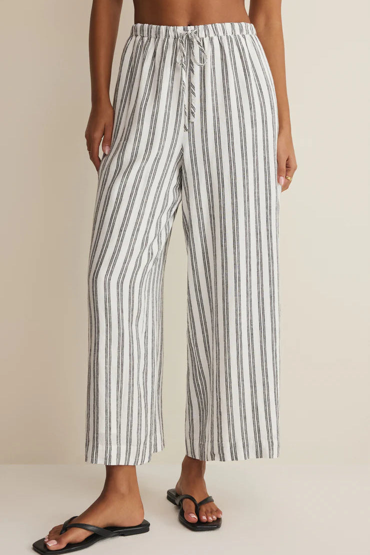 White-and-dark vertical striped wide-leg pants with elastic waistband and side pockets
