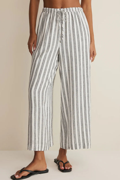 White-and-dark vertical striped wide-leg pants with elastic waistband and side pockets