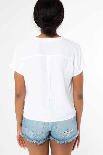 Chalk short-sleeve button tie-front top, back view with draped fabric at hem