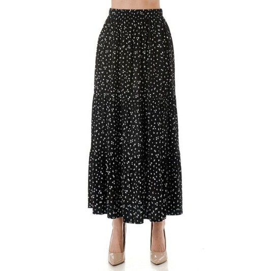 Black ditsy print tiered maxi skirt with elastic waistband and flowing tiered hem