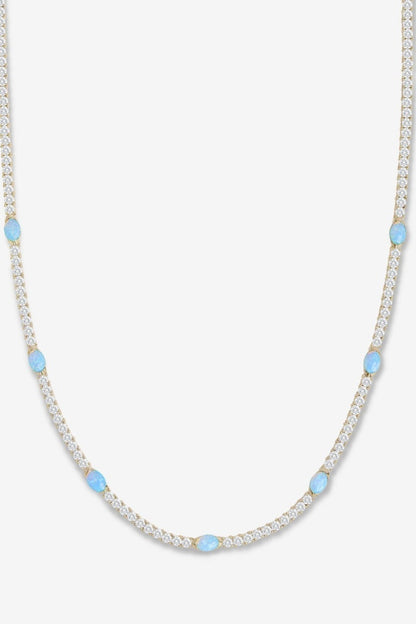 Gold and blue necklace on a white backdrop
