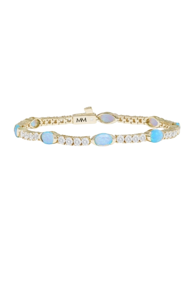 Gold-tone tennis bracelet with blue oval stones and crystal links