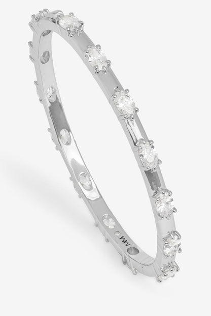 Silver bracelet with embedded diamonds on a white background