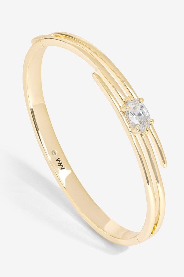 Gold ring with a diamond on a white background