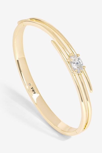 Gold ring with a diamond on a white background