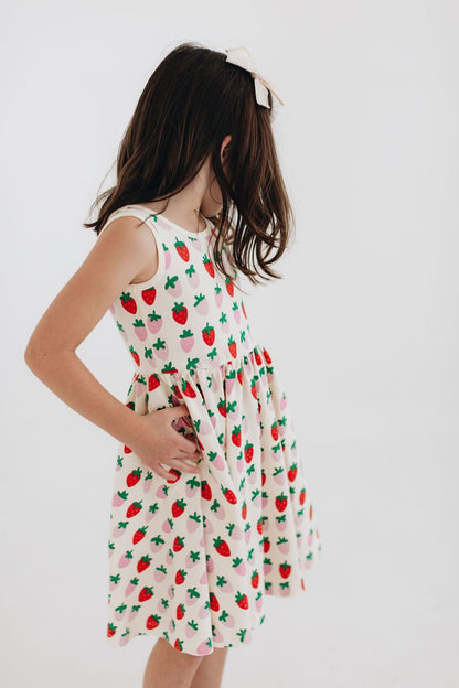 White twirl dress with strawberry and cactus print, gathered waist and sleeveless tank
