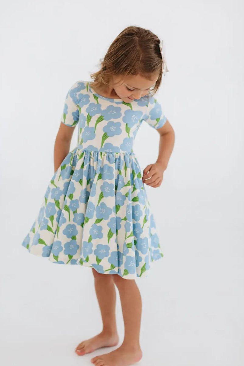 Girls twirl dress in light blue floral print, short sleeves, gathered skirt flare.