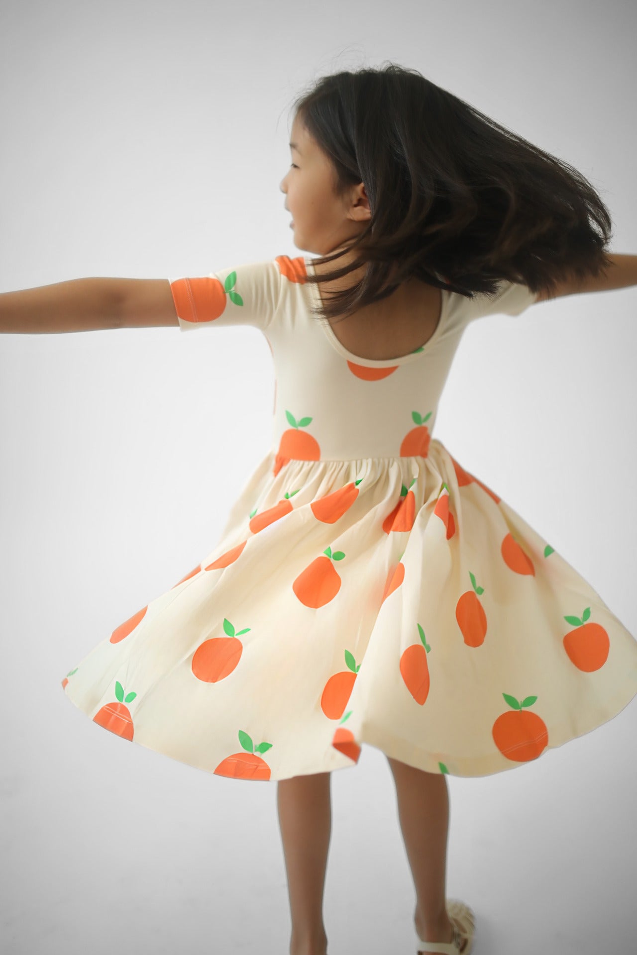 Girls orange fruit print twirl dress, short sleeves, full gathered skirt