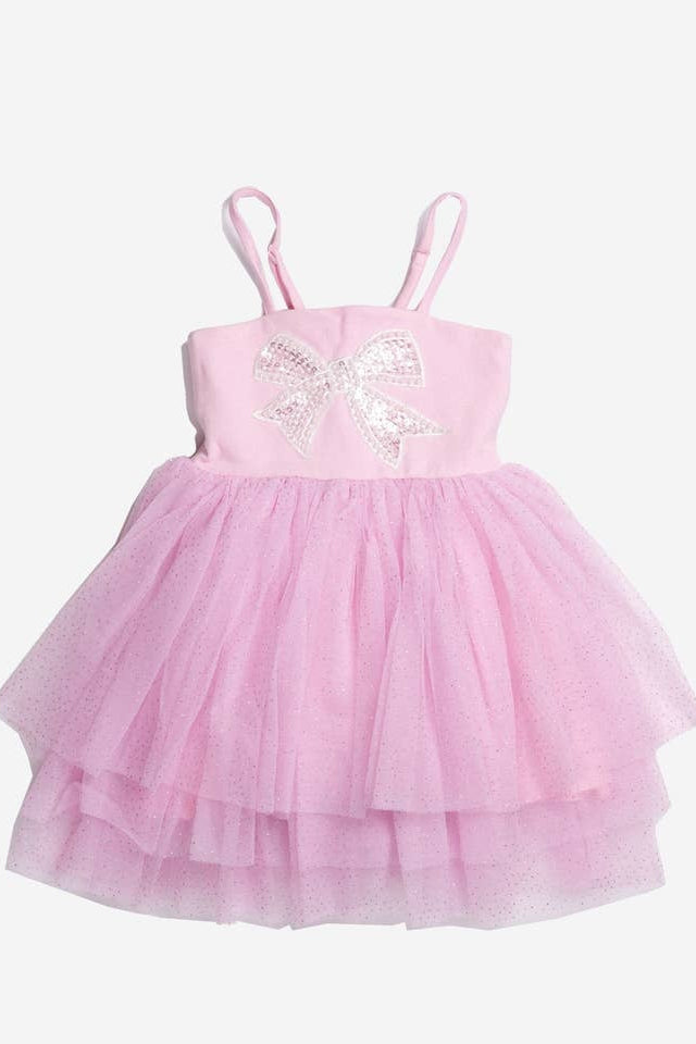 Pink dress with a white sequin bow on a white background