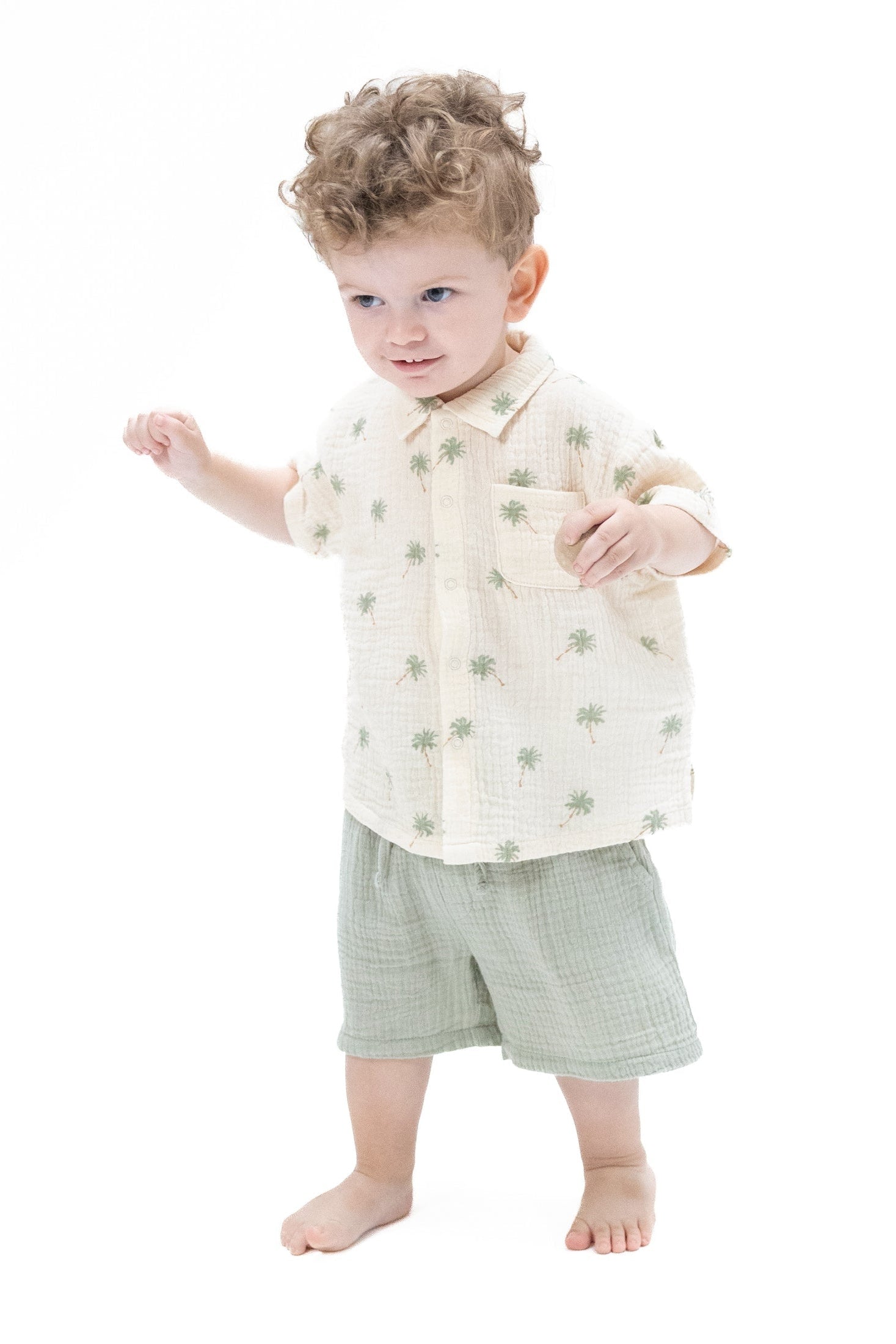 Polo button-up shirt with casual shorts, cream palm print, textured gray-green